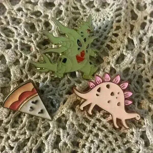 Novelty pin lot, including 1 Pokémon pin
